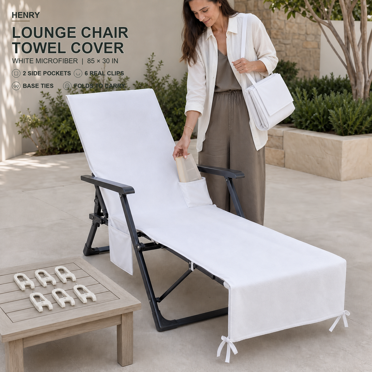 White microfiber lounge chair towel cover with top pocket, two side pockets, six clips, base ties and folded carry construction