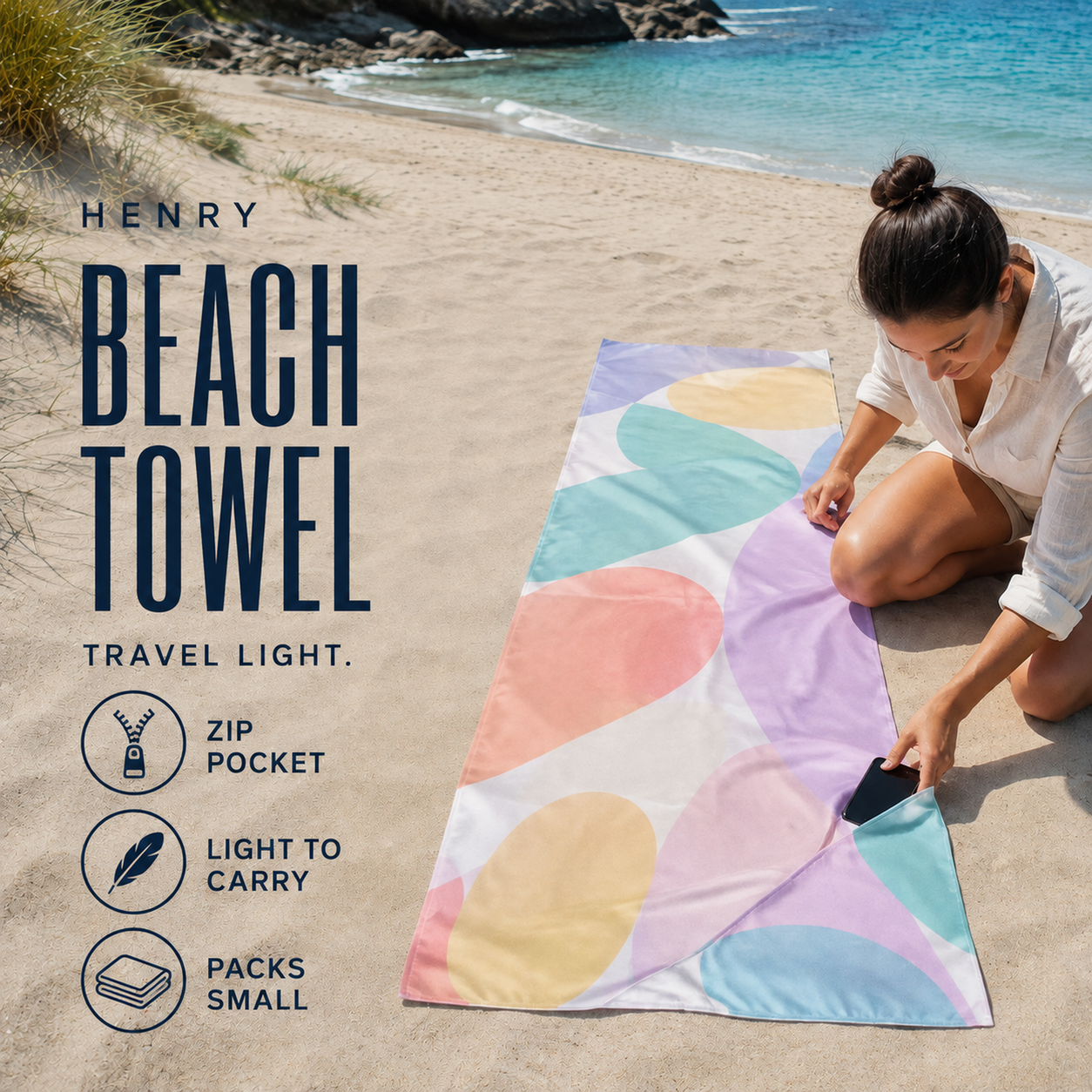 Pastel-print rectangular beach towel with rounded color forms and an integrated diagonal zip pocket near one corner